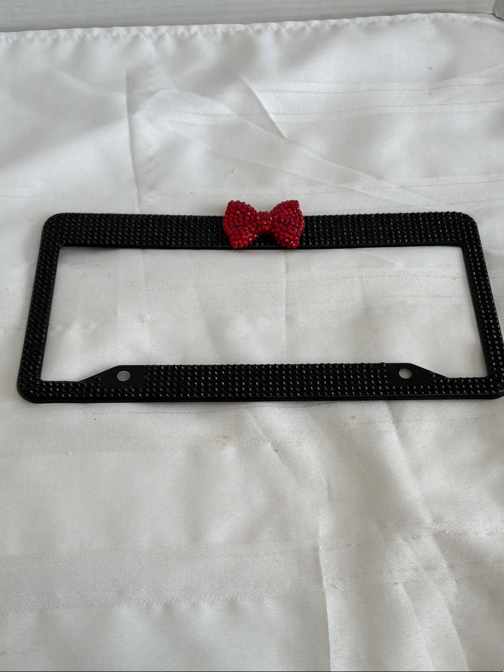 Black Rhinestone License Plate Frame with Red Bow Accent